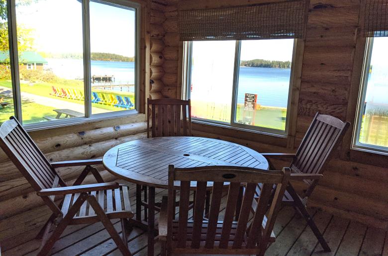 Three season porch with seating that overlooks the beach.