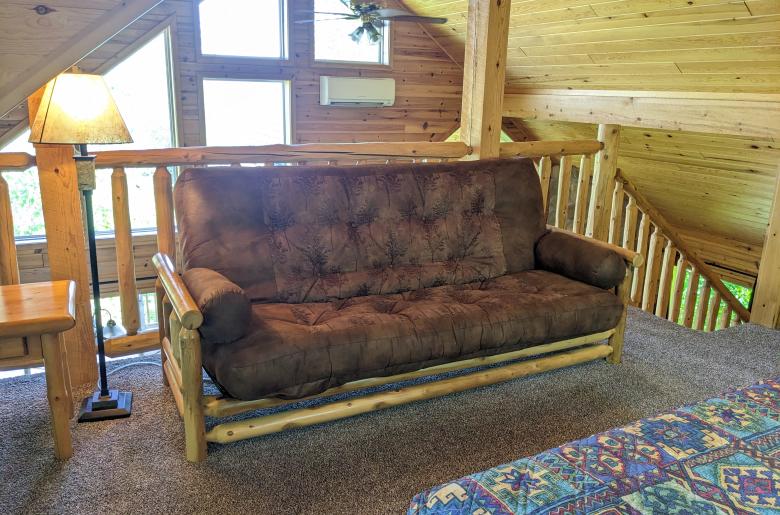 Loft area with a futon.