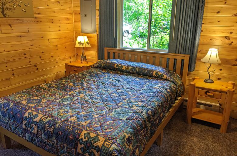 Main floor bedroom with a queen bed.