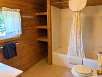 Upstairs bathroom with standard tub/shower.